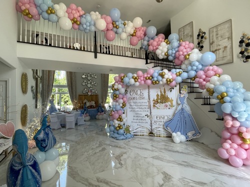 Room and staircase decorated with balloon accents and storybook motif