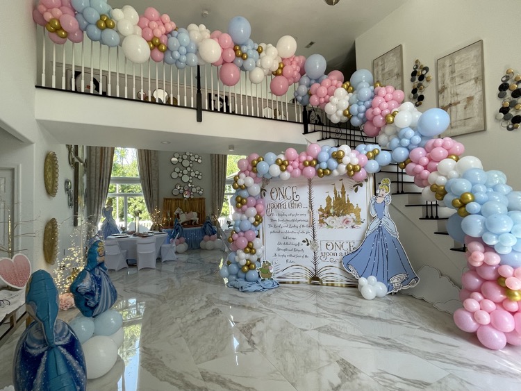 free-standing balloon garland over staircase - party planning